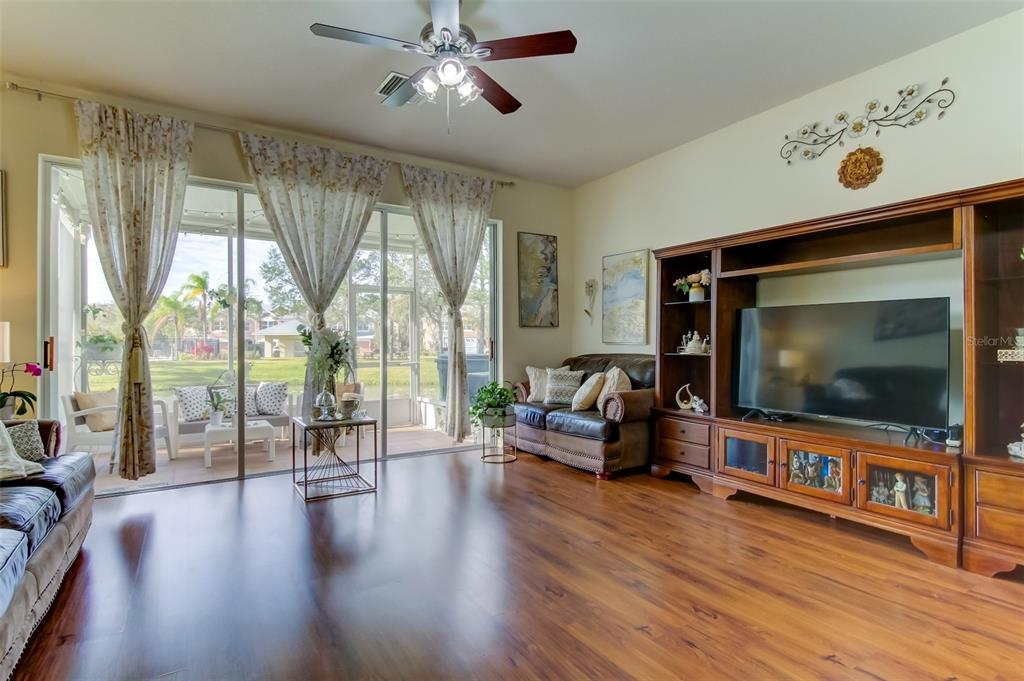 26642 Castleview Way Wesley Chapel, FL 33544 - Photo 18 of 50 a living room with furniture and a flat screen tv