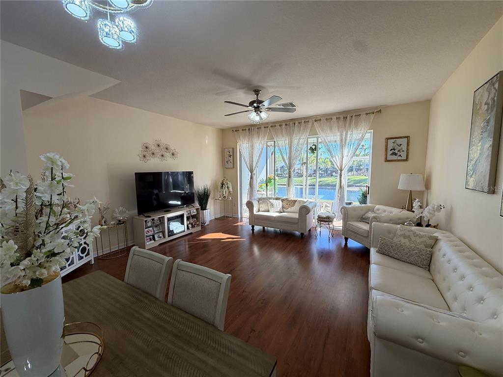 26642 Castleview Way Wesley Chapel, FL 33544 - Photo 20 of 50 a living room with furniture and a flat screen tv