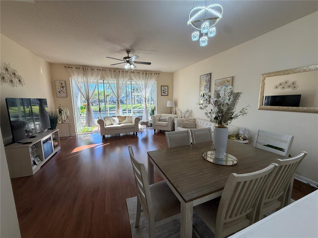 26642 Castleview Way Wesley Chapel, FL 33544 - Photo 21 of 50 a view of a dining room with furniture window and wooden floor
