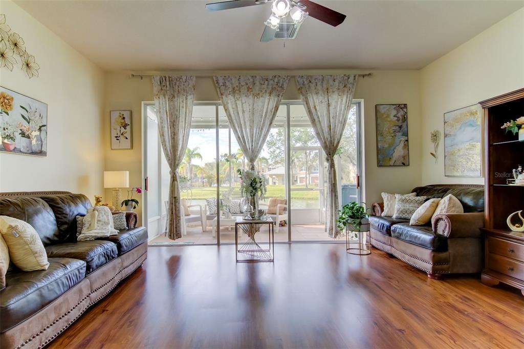 26642 Castleview Way Wesley Chapel, FL 33544 - Photo 22 of 50 a living room with furniture and a large window