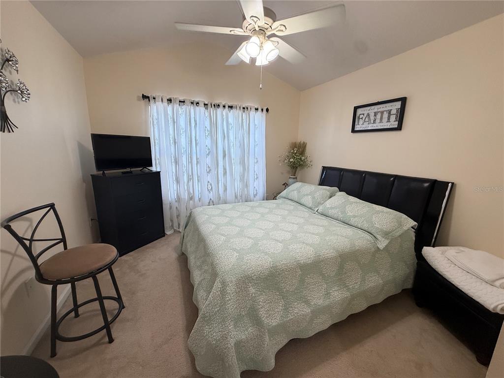 26642 Castleview Way Wesley Chapel, FL 33544 - Photo 28 of 50 a bedroom with a bed and a chandelier