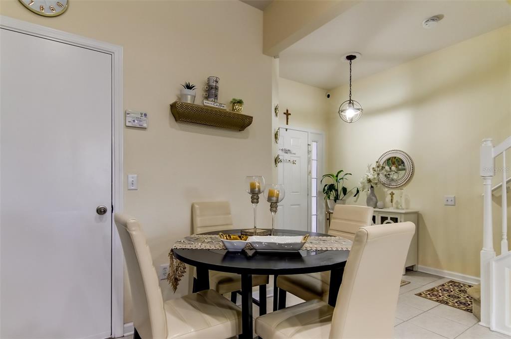 26642 Castleview Way Wesley Chapel, FL 33544 - Photo 3 of 50 a view of a dining room with furniture and wooden floor
