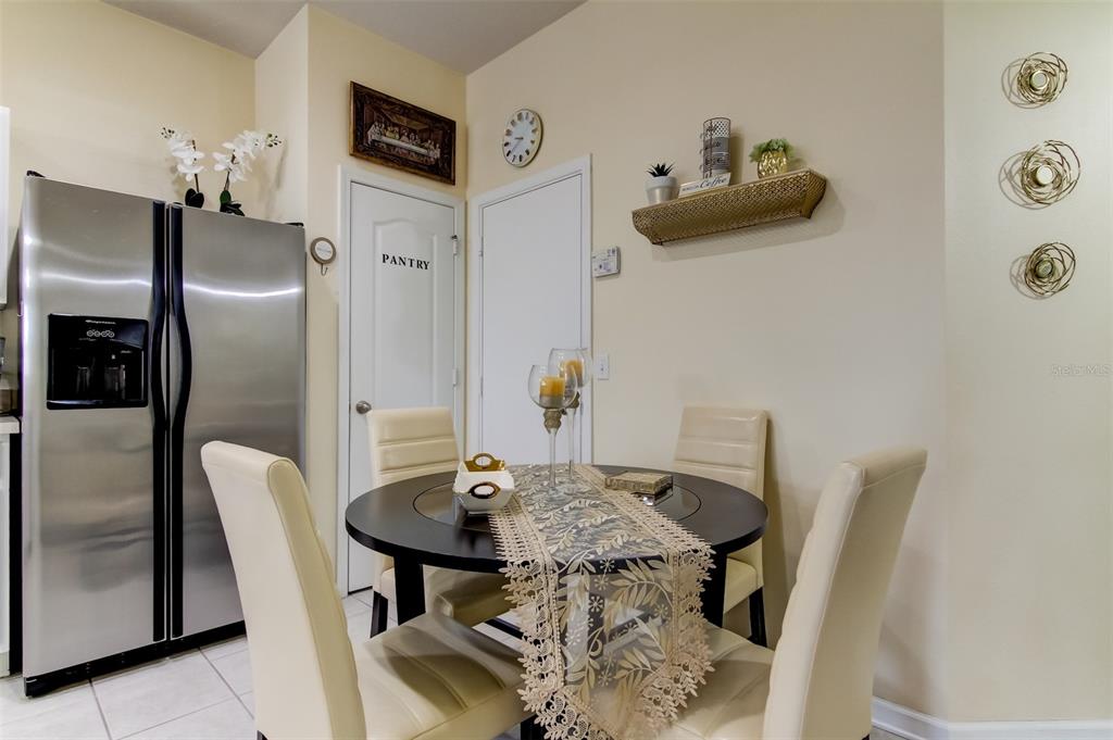 26642 Castleview Way Wesley Chapel, FL 33544 - Photo 4 of 50 a view of a dining room with furniture and a chandelier