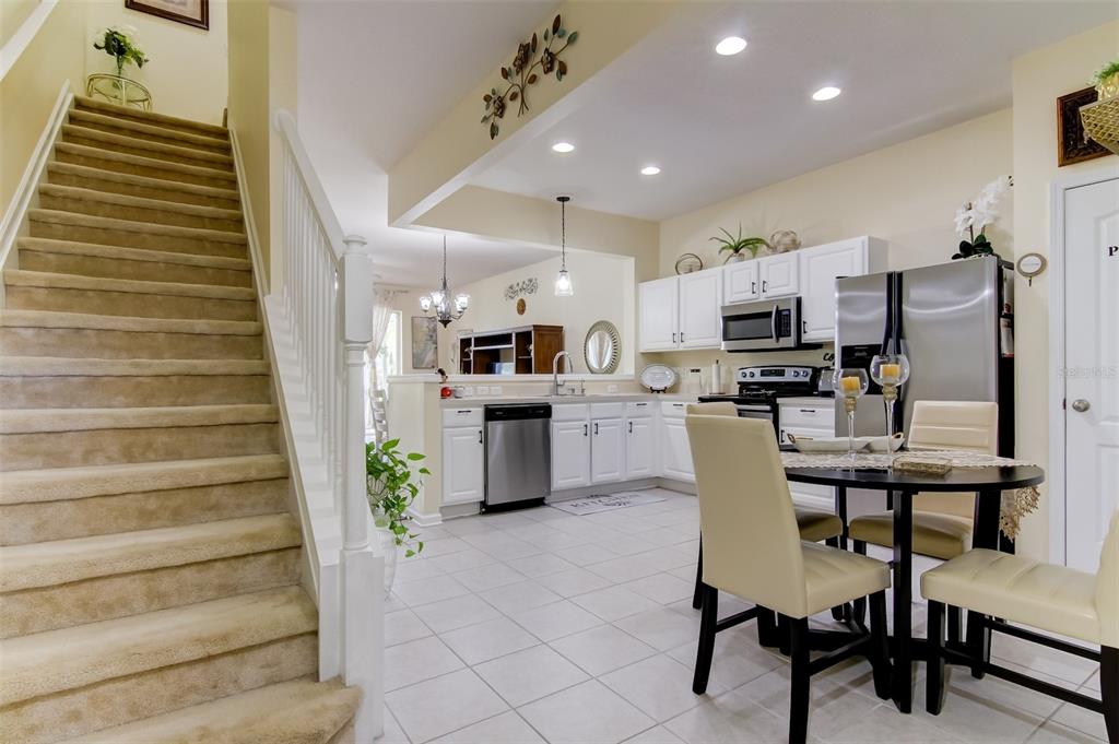 26642 Castleview Way Wesley Chapel, FL 33544 - Photo 6 of 50 a kitchen with cabinets and chairs