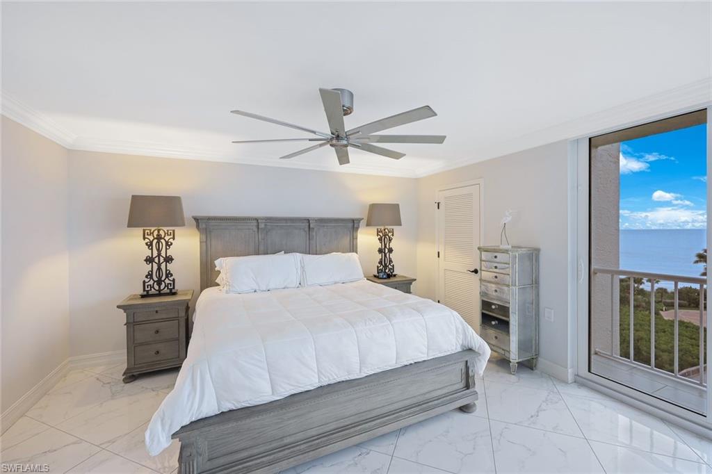 50 Seagate Drive, Unit 703 Naples, FL 34103 - Photo 20 of 34 a bedroom with a bed and window