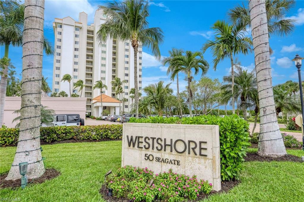 50 Seagate Drive, Unit 703 Naples, FL 34103 - Photo 9 of 34 a sign on the side of the wall