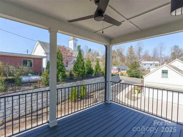 a view of a balcony with wooden floor