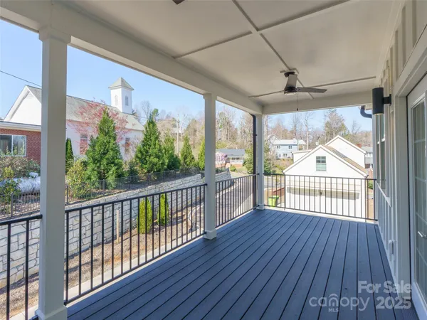 a view of a porch with wooden floor