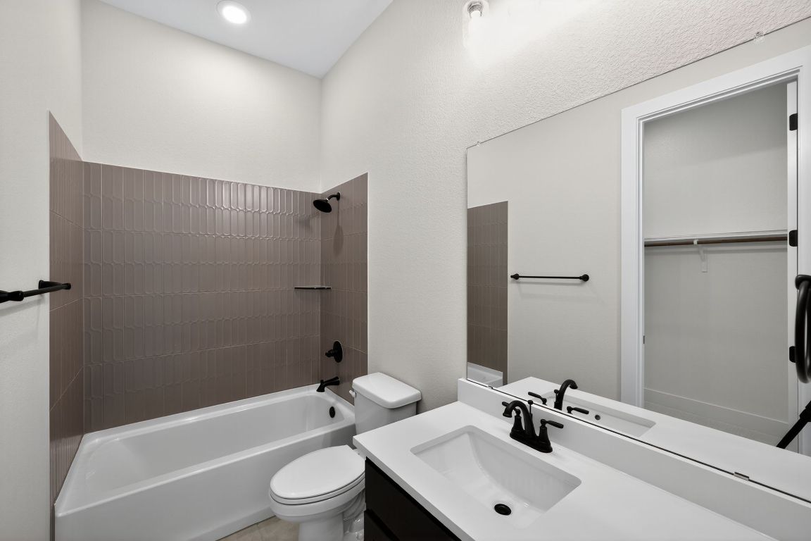 205 Three Rivers Road Georgetown, TX 78633 - Photo 18 of 32 a bathroom with a sink a toilet and shower