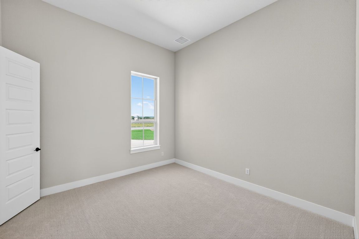 205 Three Rivers Road Georgetown, TX 78633 - Photo 24 of 32 an empty room with a window