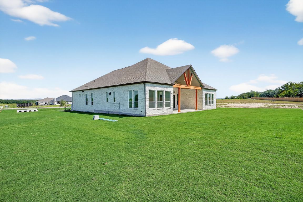 205 Three Rivers Road Georgetown, TX 78633 - Photo 30 of 32 a view of a house with a backyard
