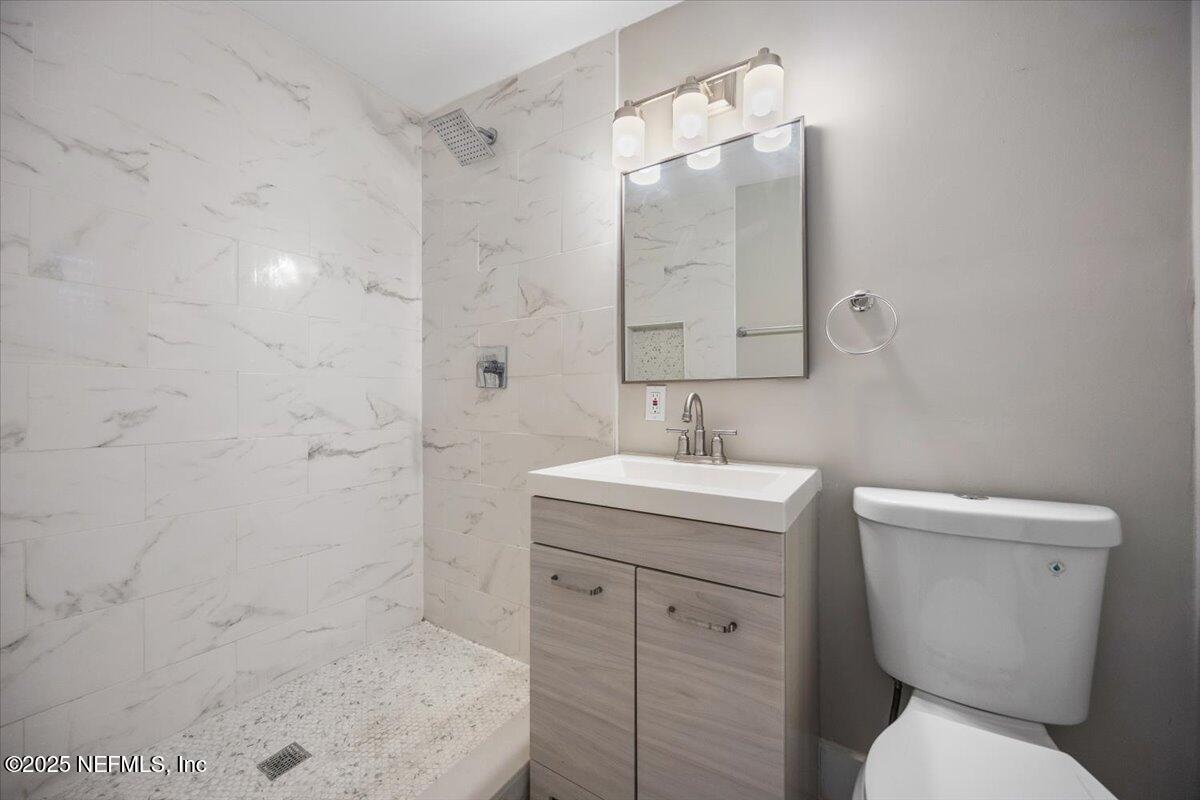 9379 Orme Road Jacksonville, FL 32220 - Photo 14 of 19 a bathroom with a sink toilet and shower