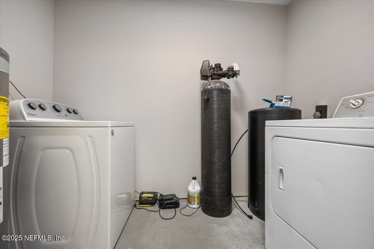9379 Orme Road Jacksonville, FL 32220 - Photo 15 of 19 a view of a storage & utility room with dryer and washer