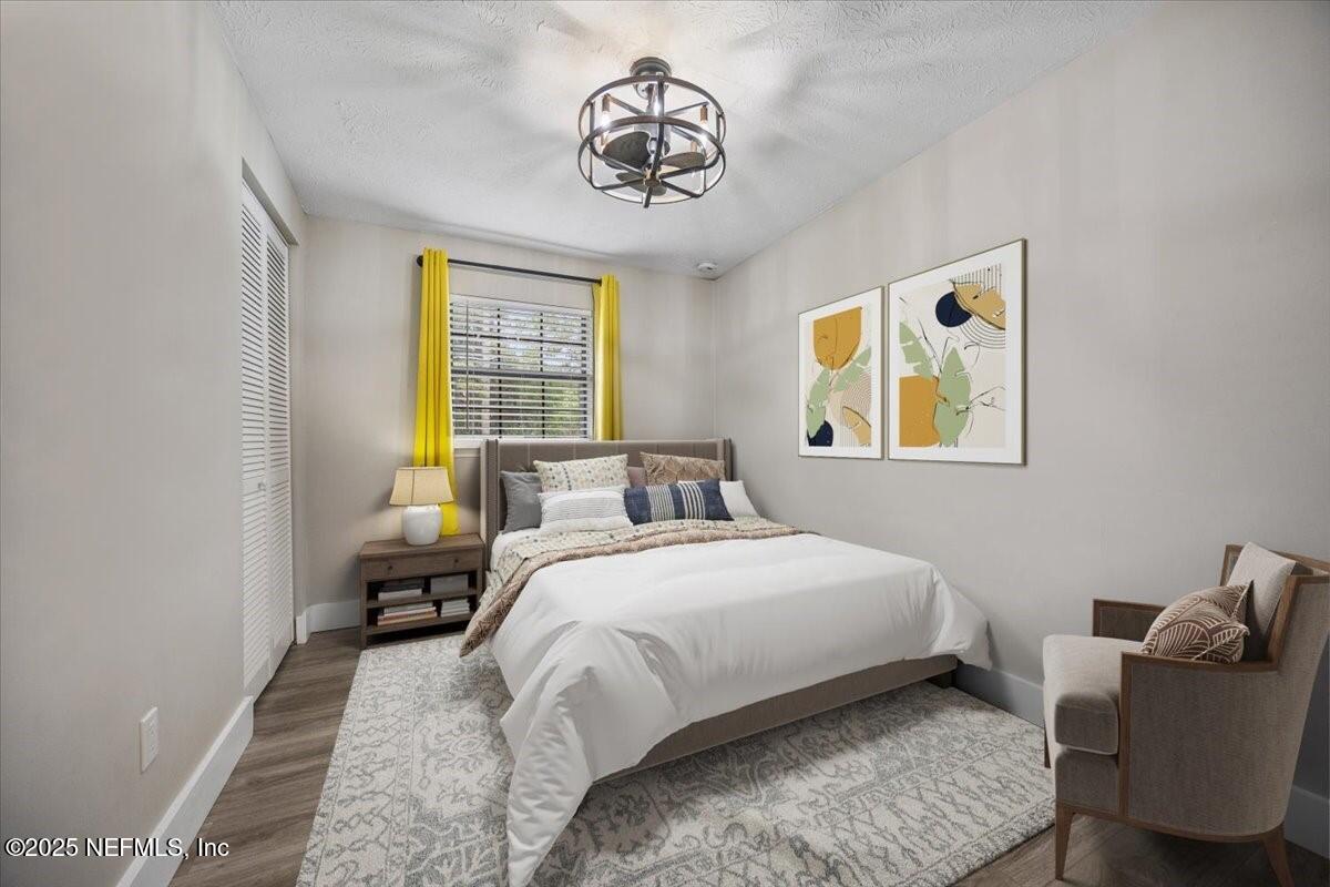 9379 Orme Road Jacksonville, FL 32220 - Photo 8 of 19 a bedroom with a bed and a window