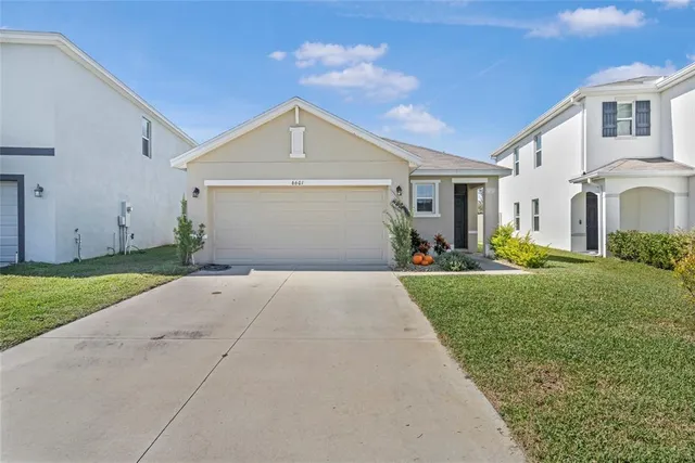 a view of a house with a yard
