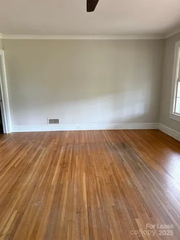 a view of room with wooden floor