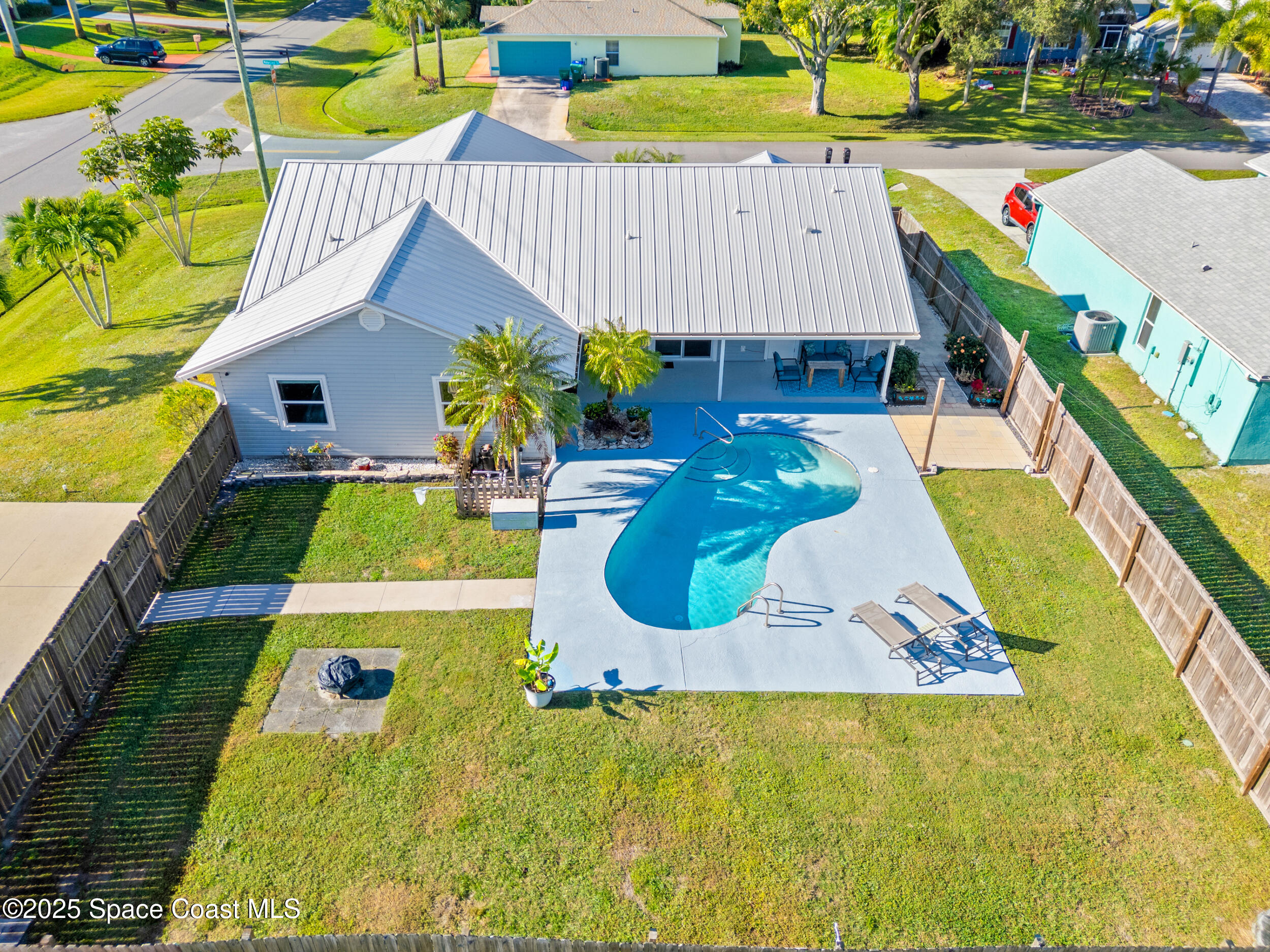 a view of a swimming pool with sitting area
