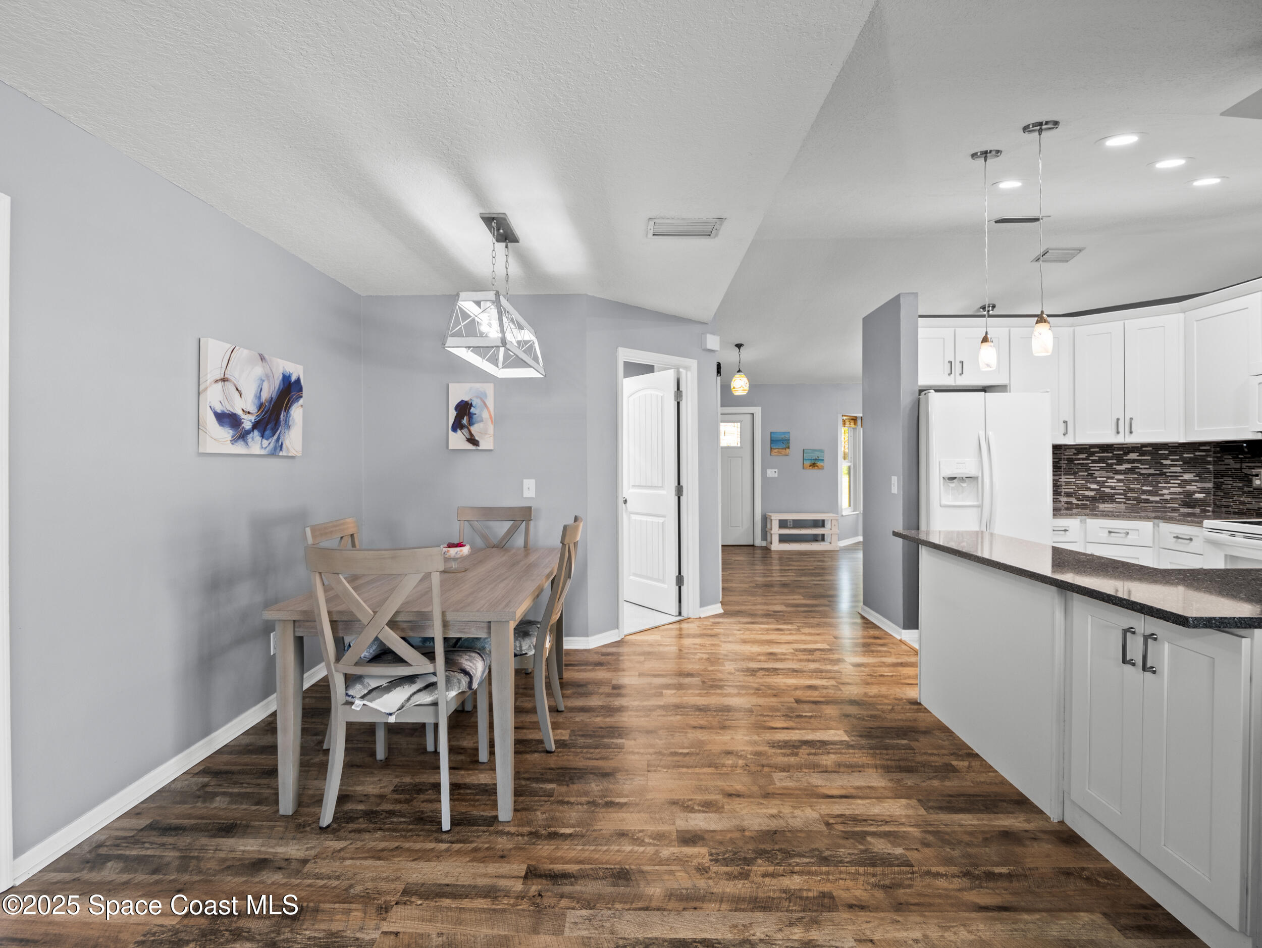 402 Watercrest Street Sebastian, FL 32958 - Photo 18 of 40 a view of a dining room with furniture