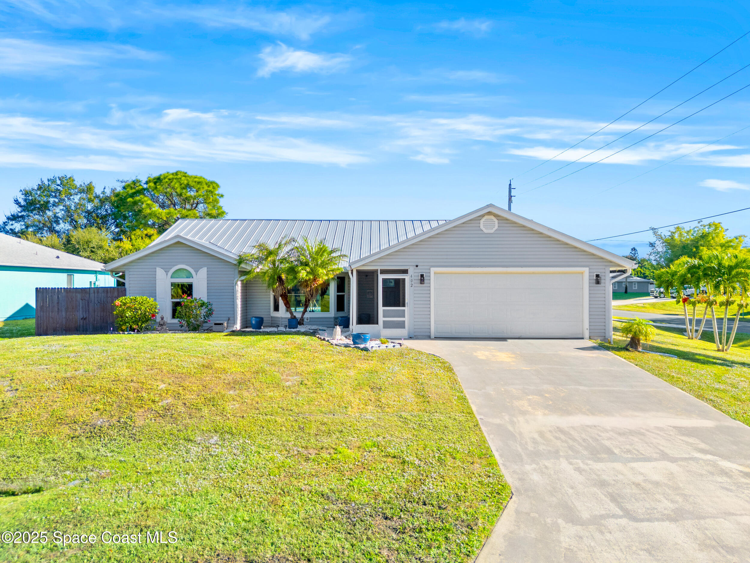 402 Watercrest Street Sebastian, FL 32958 - Photo 2 of 40 a house view with a garden space