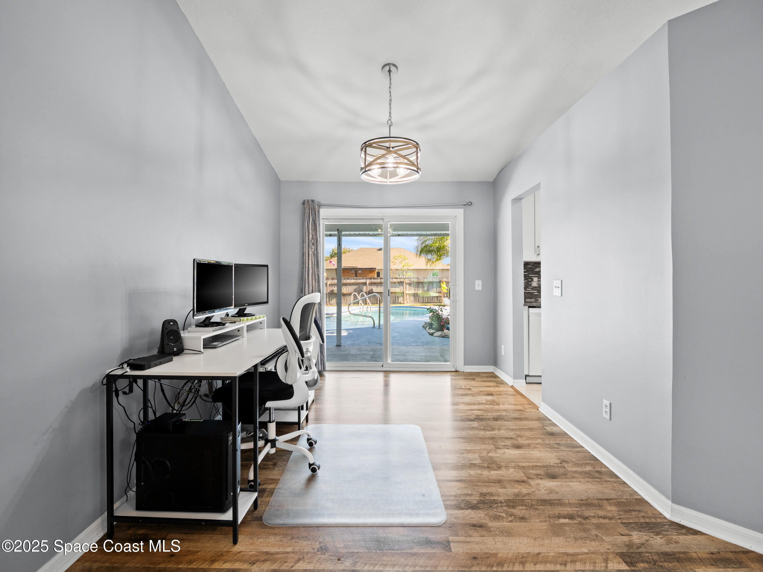 402 Watercrest Street Sebastian, FL 32958 - Photo 22 of 40 a view of a workspace with furniture and a window