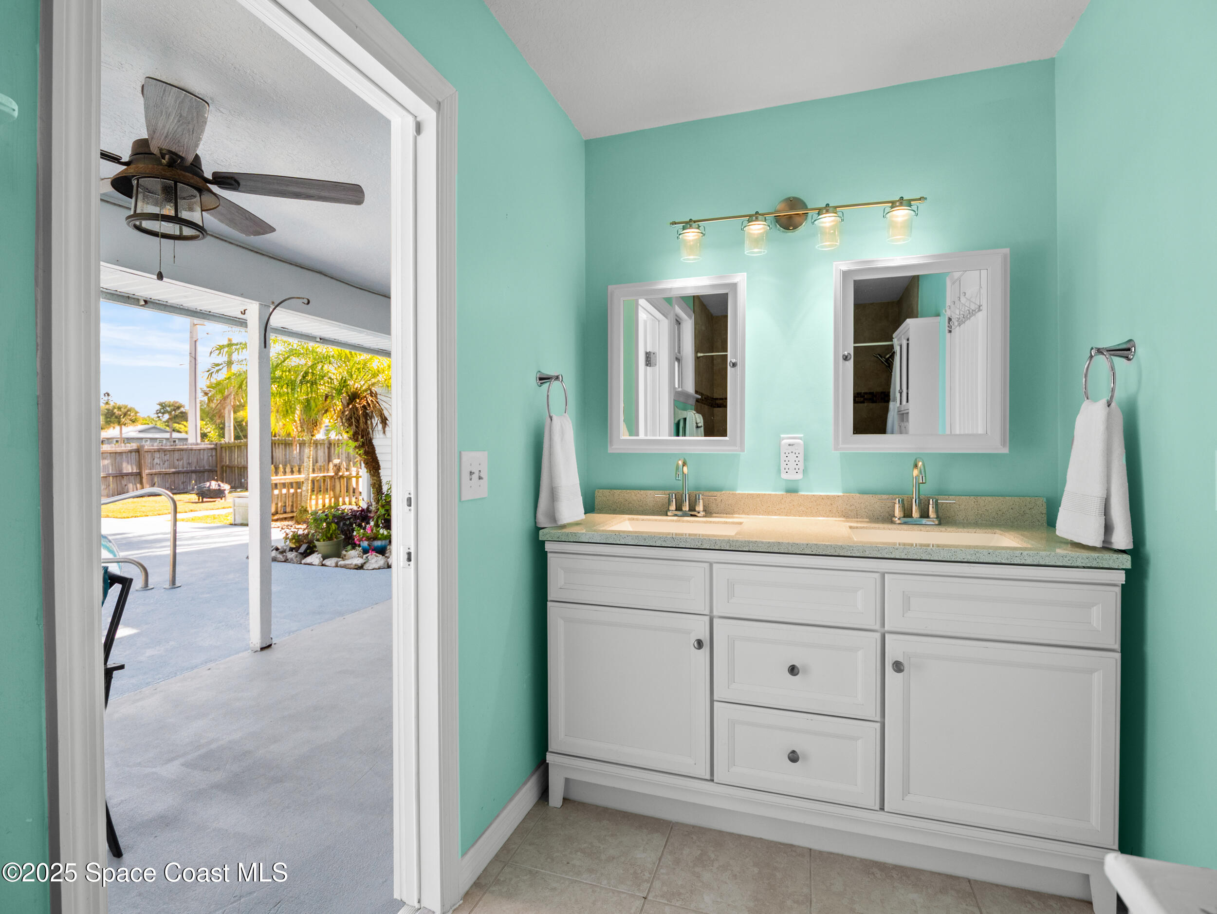 402 Watercrest Street Sebastian, FL 32958 - Photo 27 of 40 a bathroom with a sink vanity and mirror