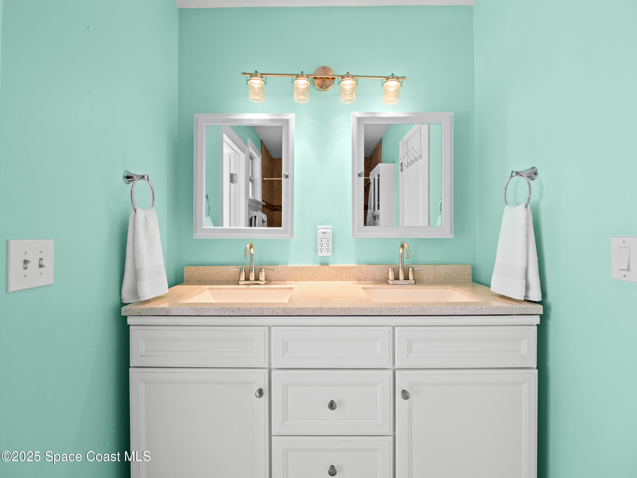 402 Watercrest Street Sebastian, FL 32958 - Photo 28 of 40 a bathroom with a sink and a mirror