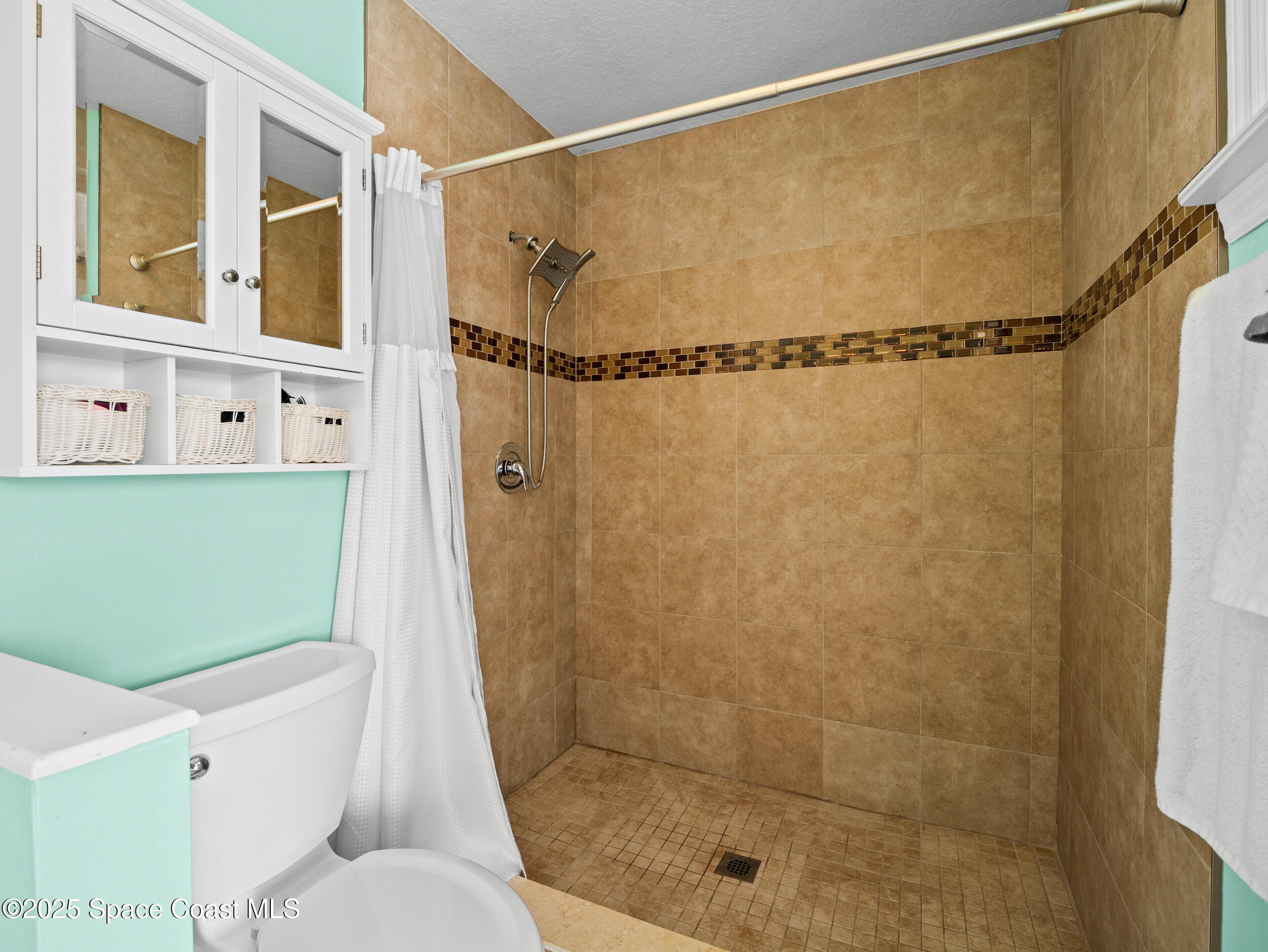 402 Watercrest Street Sebastian, FL 32958 - Photo 29 of 40 a bathroom with a shower and a toilet