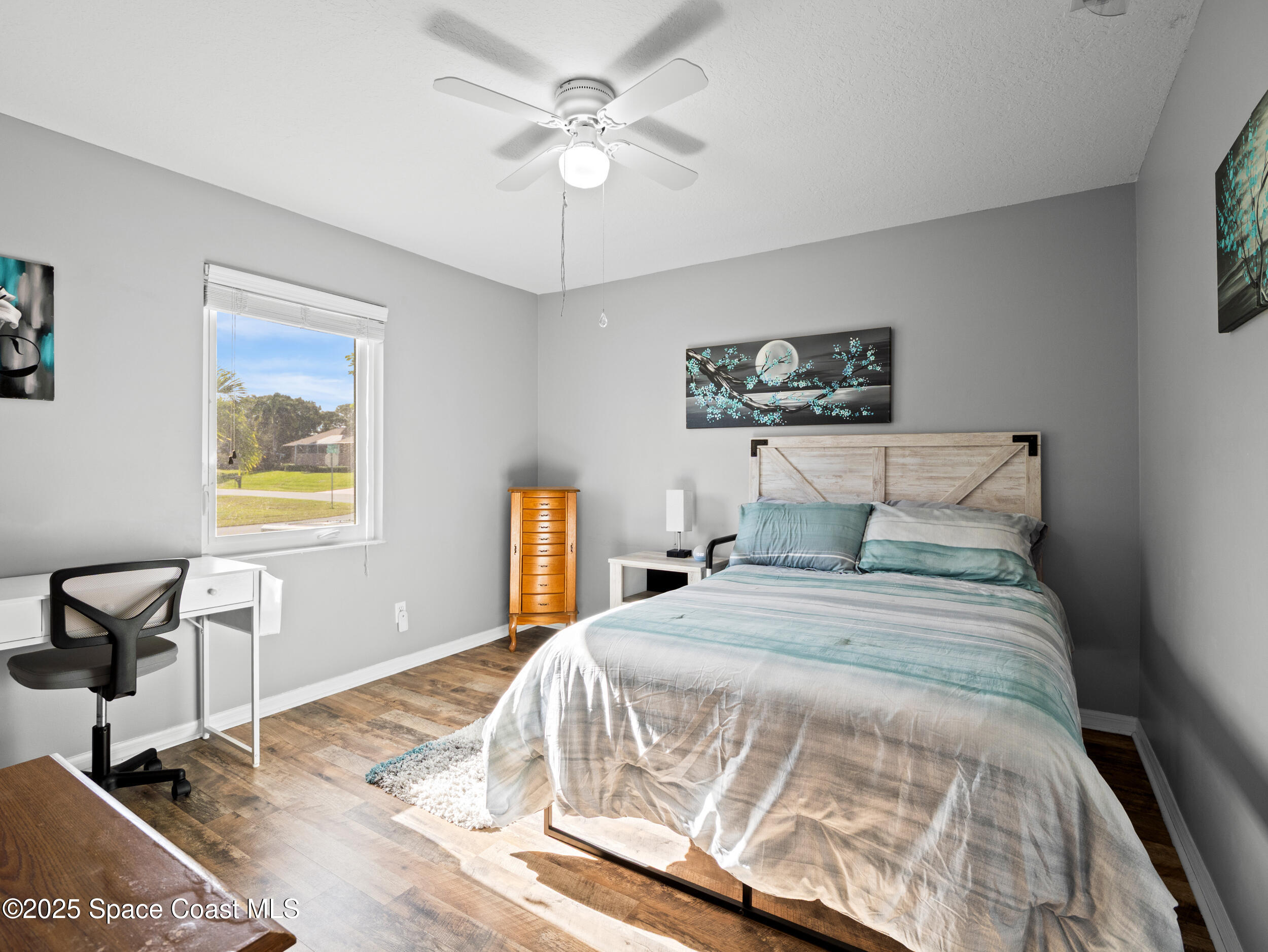 402 Watercrest Street Sebastian, FL 32958 - Photo 32 of 40 a bedroom with a bed and a table in it