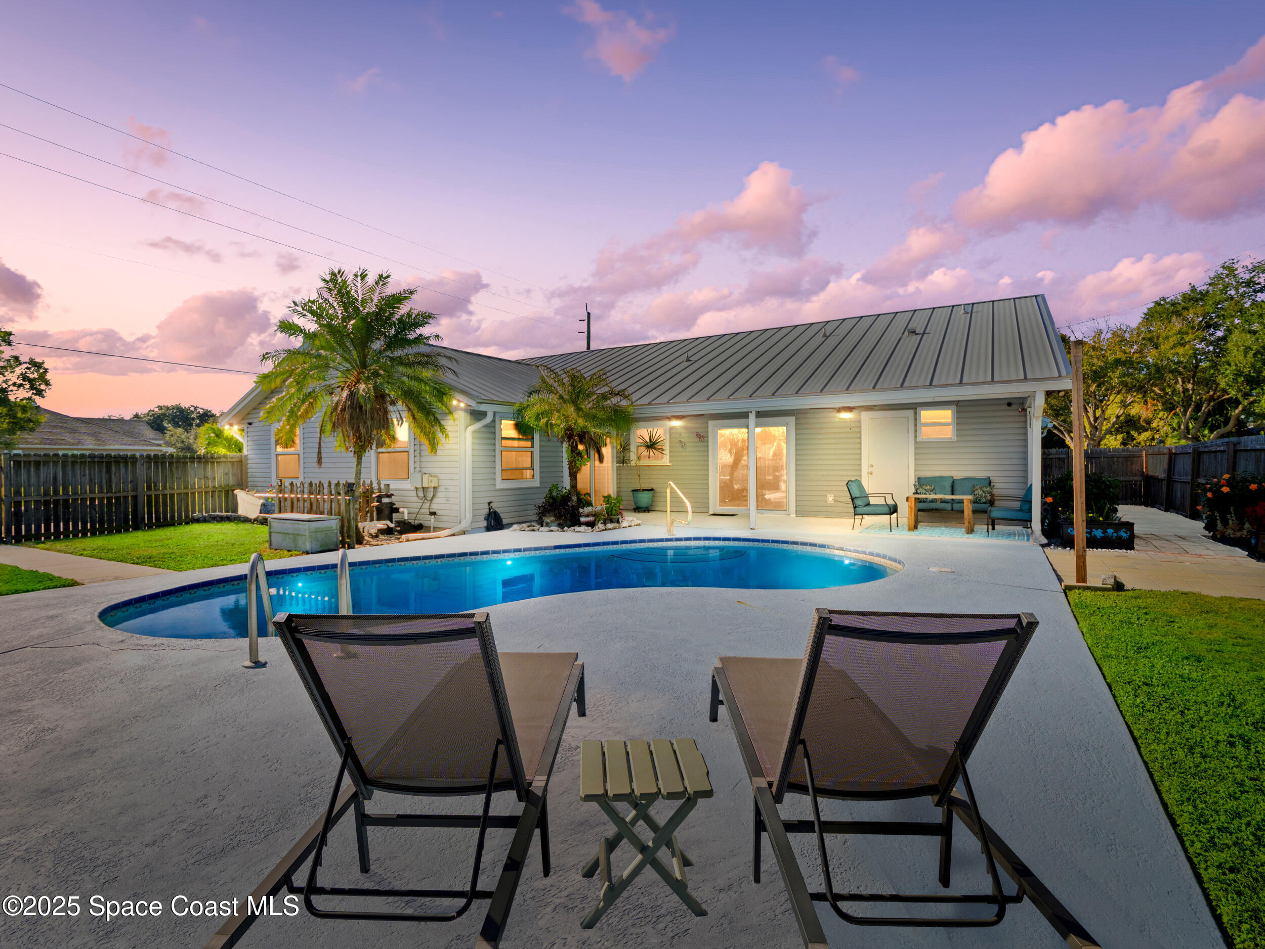 402 Watercrest Street Sebastian, FL 32958 - Photo 5 of 40 a view of a backyard with sitting area and furniture