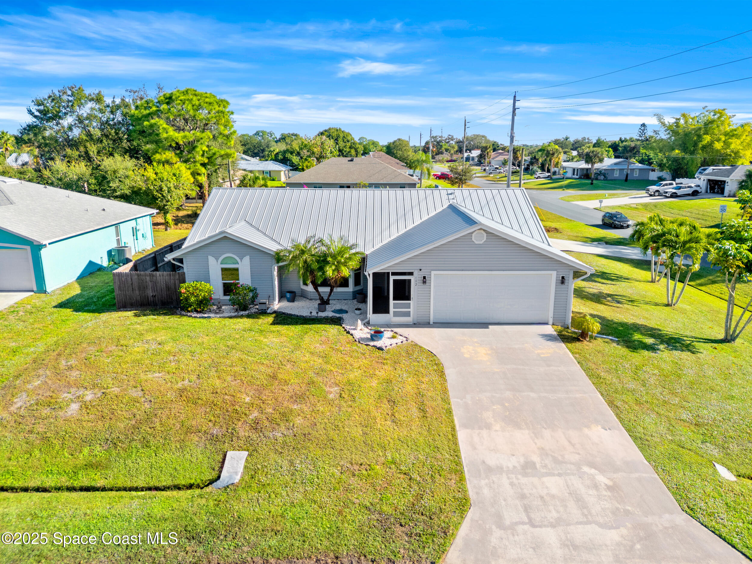 402 Watercrest Street Sebastian, FL 32958 - Photo 8 of 40 a front view of a house with a yard