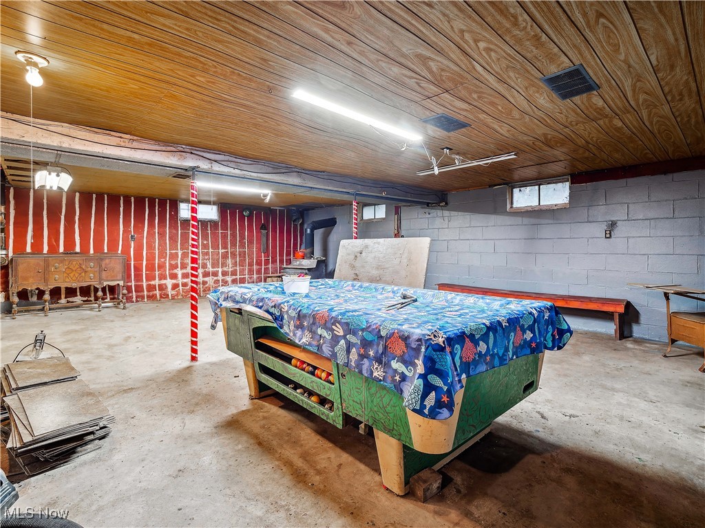 35400 Chestnut Ridge Road North Ridgeville, OH 44039 - Photo 29 of 48 Playroom with concrete block wall, wooden ceiling, and unfinished concrete floors