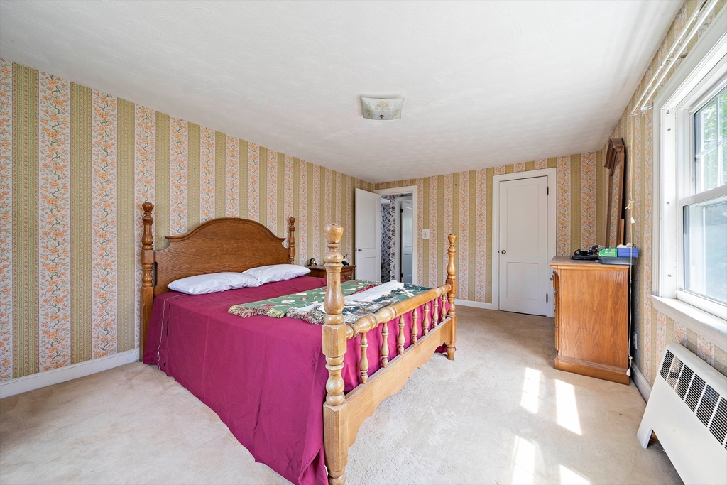 11 Latin Road Boston, MA 02132 - Photo 14 of 30 a bedroom with a bed and a window