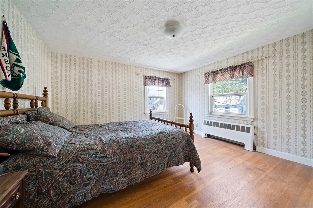 11 Latin Road Boston, MA 02132 - Photo 15 of 30 a bedroom with a bed and a window