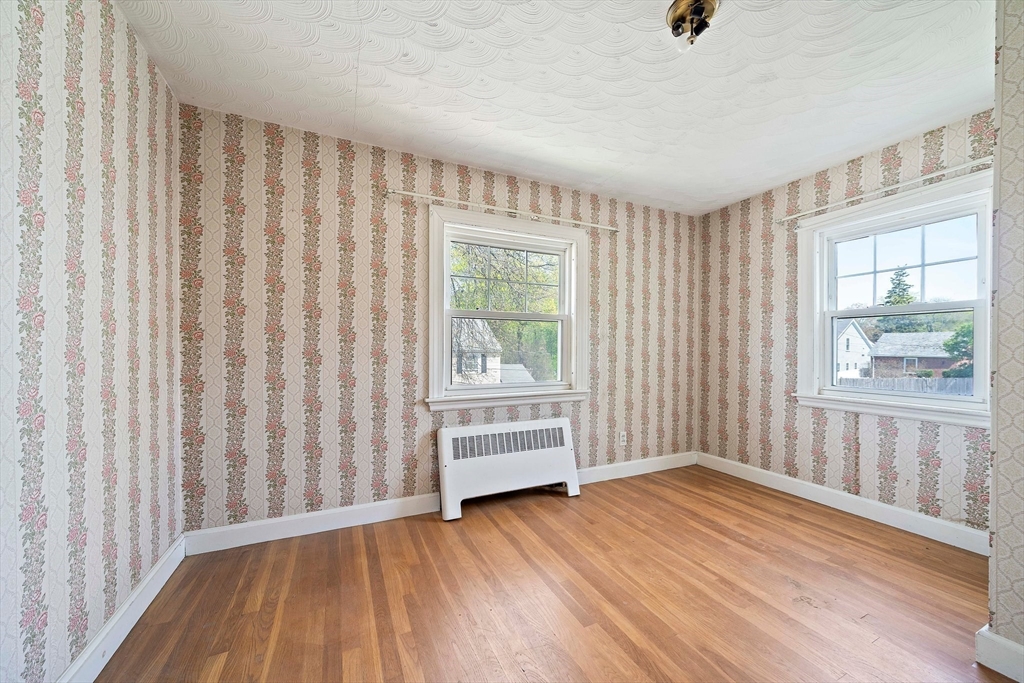 11 Latin Road Boston, MA 02132 - Photo 17 of 30 wooden floor in an empty room with a window