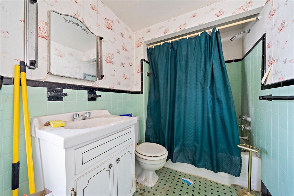 11 Latin Road Boston, MA 02132 - Photo 19 of 30 a bathroom with a sink toilet and shower