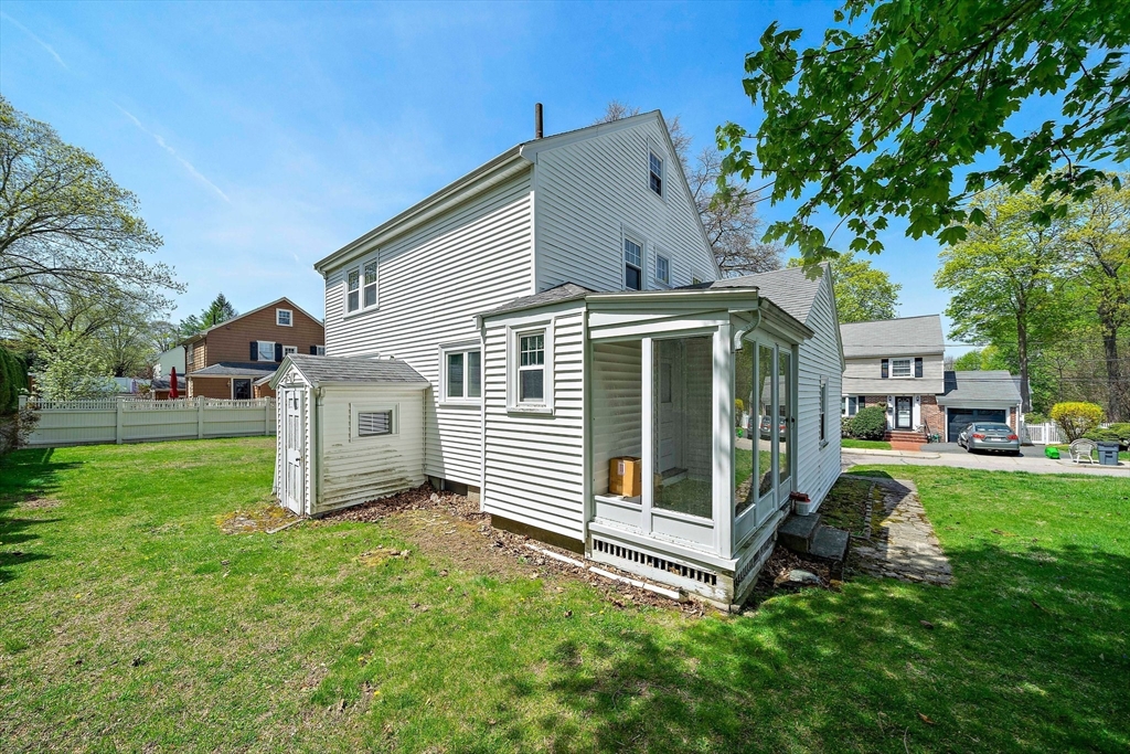 11 Latin Road Boston, MA 02132 - Photo 22 of 30 a view of a white house with a big yard plants and large trees