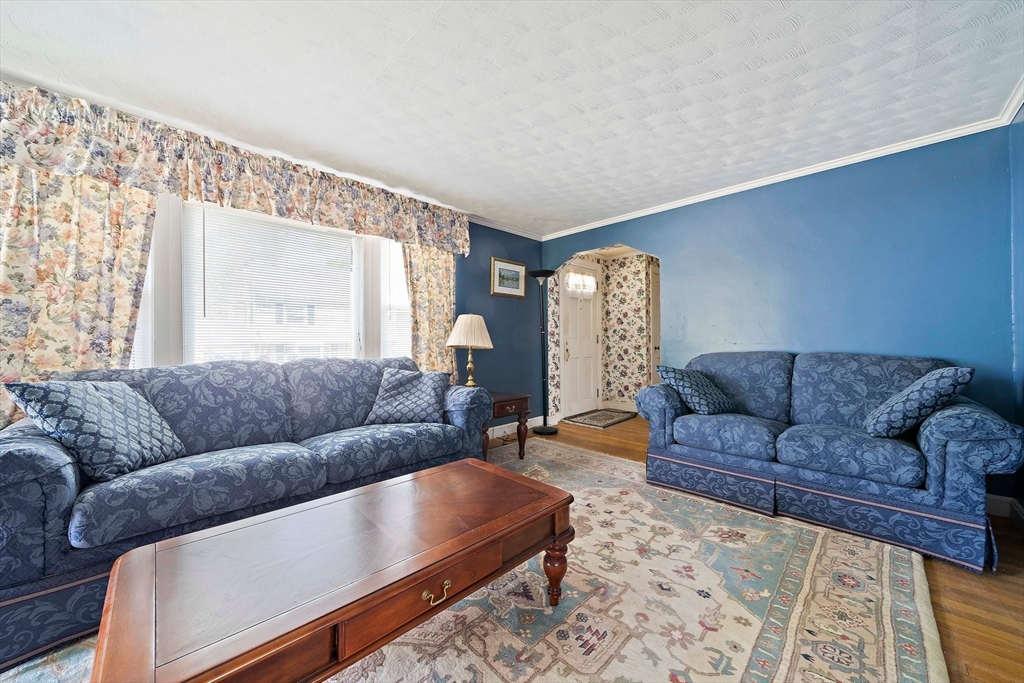 11 Latin Road Boston, MA 02132 - Photo 9 of 30 a living room with furniture and a large window