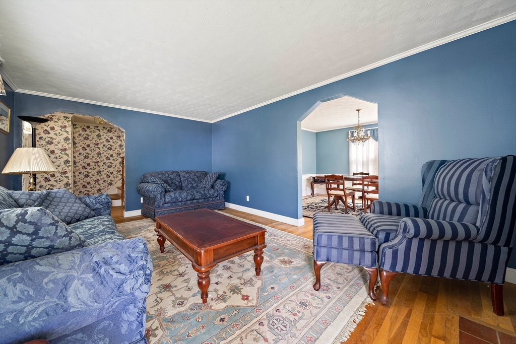 11 Latin Road Boston, MA 02132 - Photo 10 of 30 a living room with furniture and a fireplace