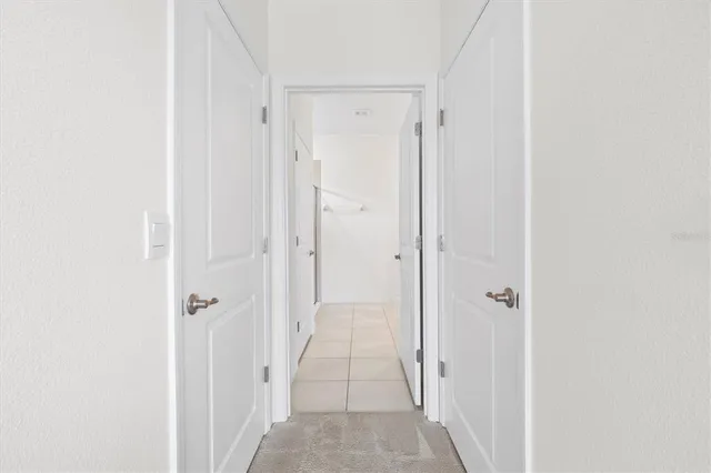 a view of a hallway with white walls
