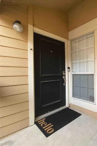 a view of a house with swimming pool and sitting area