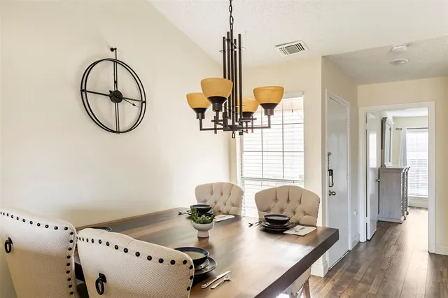 a view of dining room with furniture and wooden floor