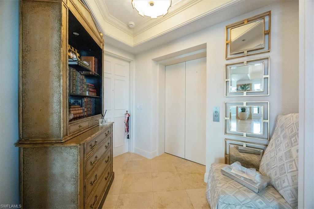 285 Grande Way, Unit 706 Naples, FL 34110 - Photo 15 of 24 a view of kitchen with furniture and wooden floor