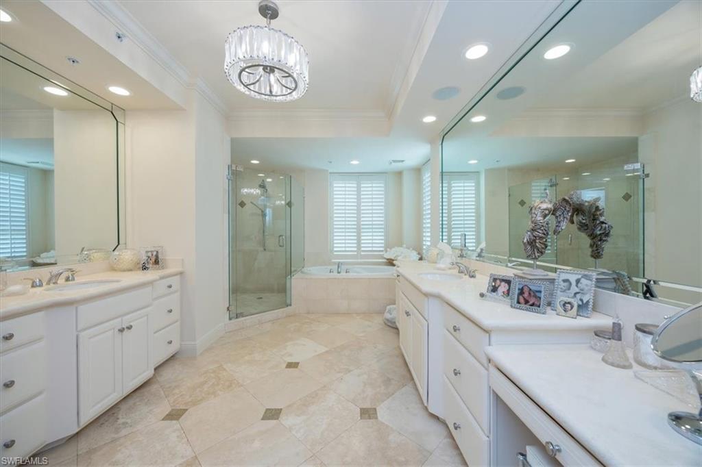 285 Grande Way, Unit 706 Naples, FL 34110 - Photo 17 of 24 a large bathroom with a double vanity sink mirror and double
