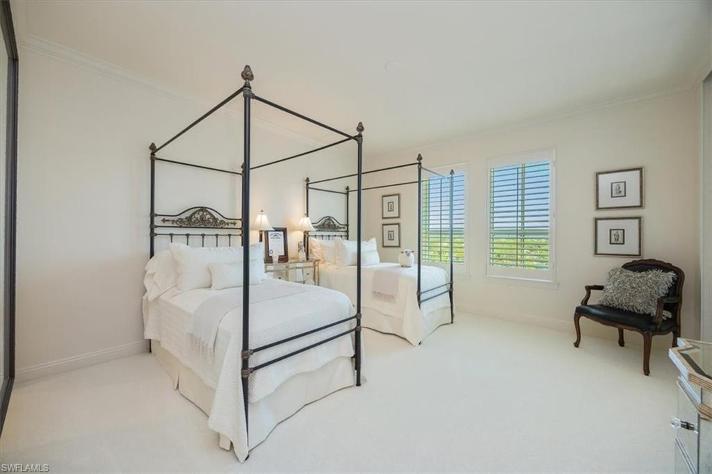 285 Grande Way, Unit 706 Naples, FL 34110 - Photo 18 of 24 a bedroom with furniture and a window