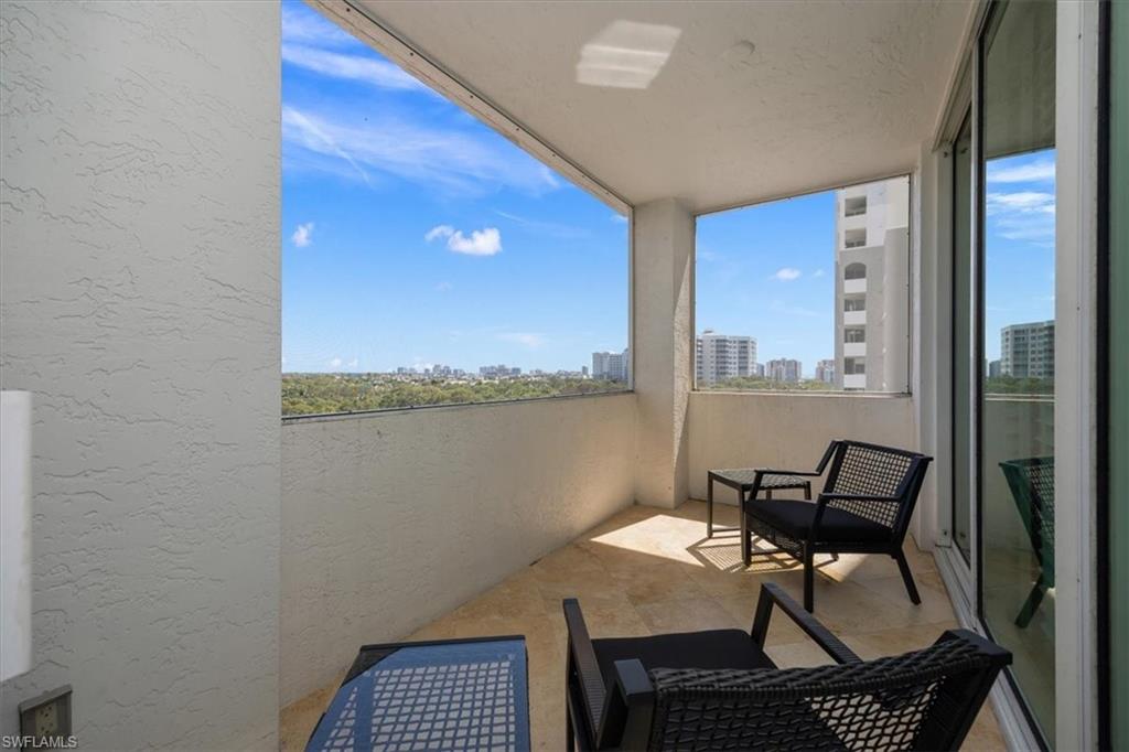 285 Grande Way, Unit 706 Naples, FL 34110 - Photo 23 of 24 a view of a workspace with furniture and a window