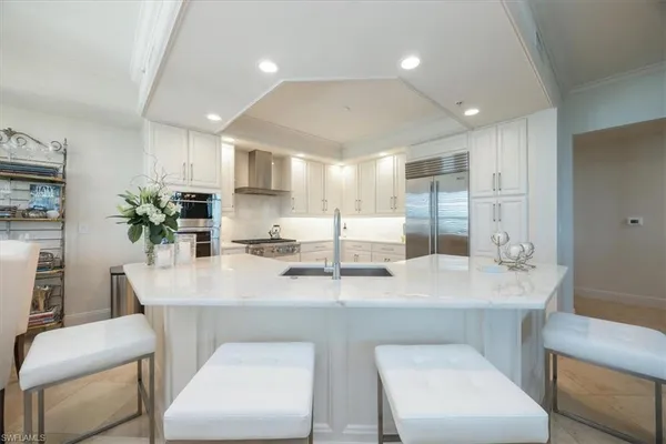 a view of kitchen island kitchen island furniture and refrigerator