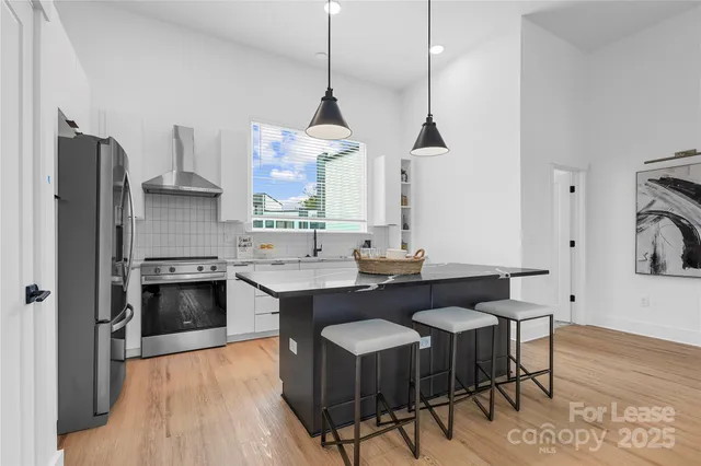 a kitchen with a sink cabinets and window