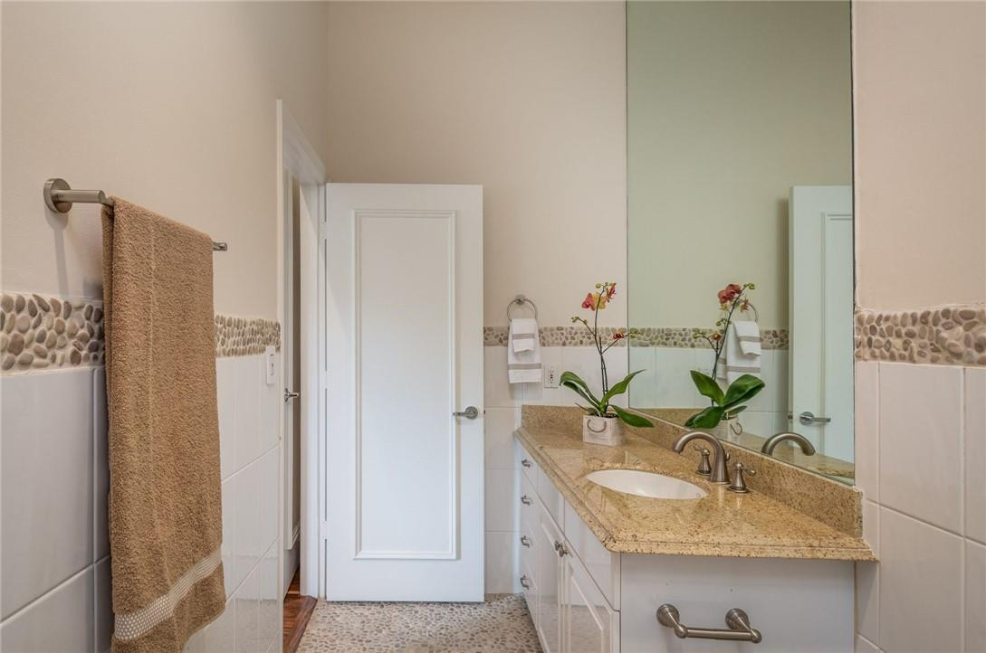 3620 Paddock Road Weston, FL 33331 - Photo 18 of 51 a bathroom with a granite countertop sink and a mirror