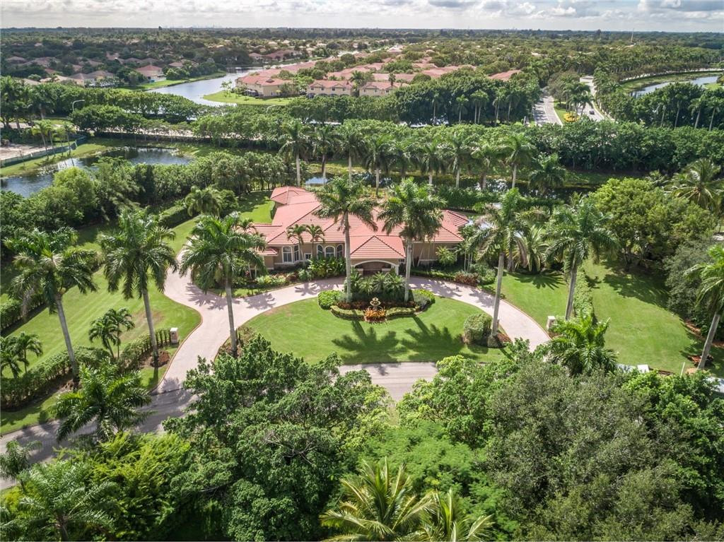 3620 Paddock Road Weston, FL 33331 - Photo 2 of 51 an aerial view of residential houses with outdoor space and trees
