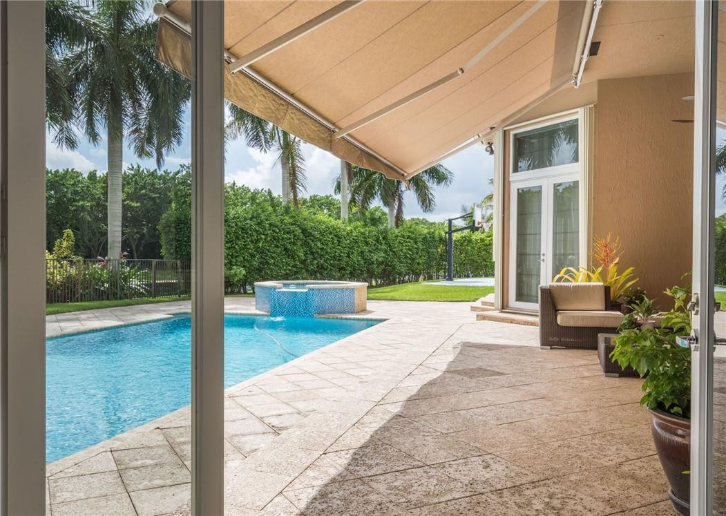 3620 Paddock Road Weston, FL 33331 - Photo 32 of 51 a view of swimming pool with patio